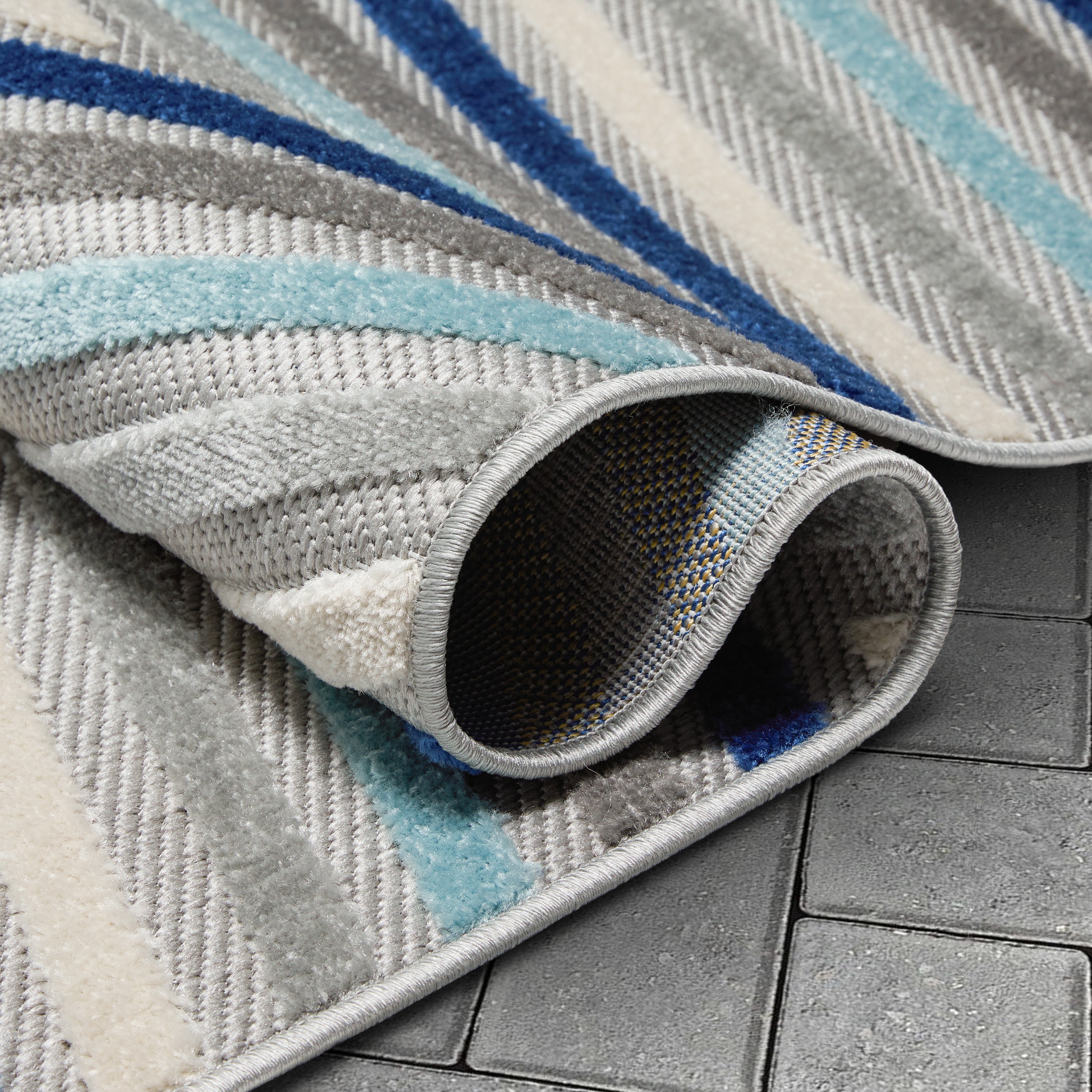 Neema Modern Chevron Striped Indoor/Outdoor Grey Blue High-Low Rug